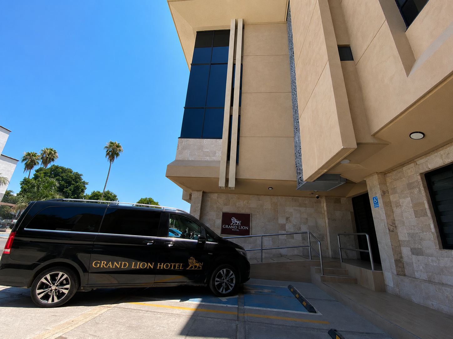 Grand Lion Hotel transfer vehicle in front of the entrance